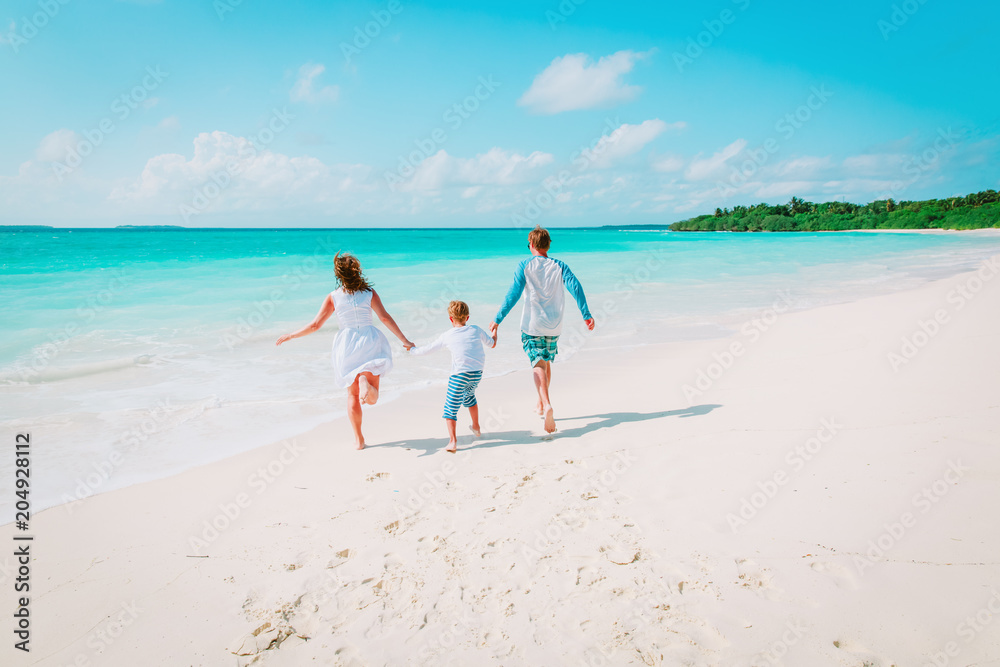 happy family enjoy tropical beach