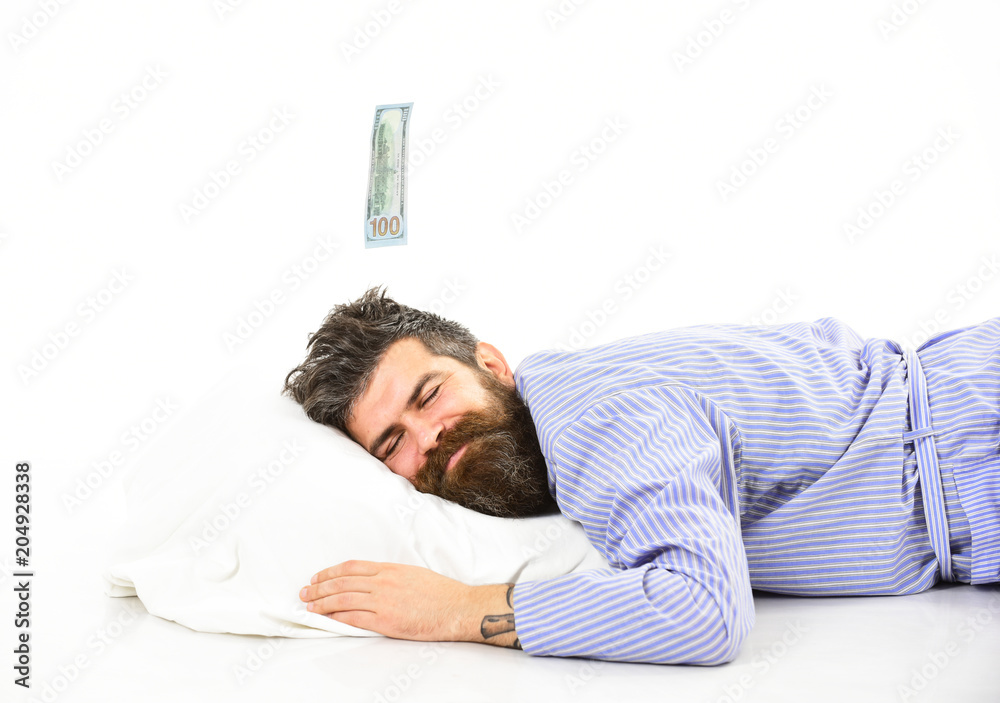 Obraz premium Man with sleepy smiling face lies on pillow, sleeps.