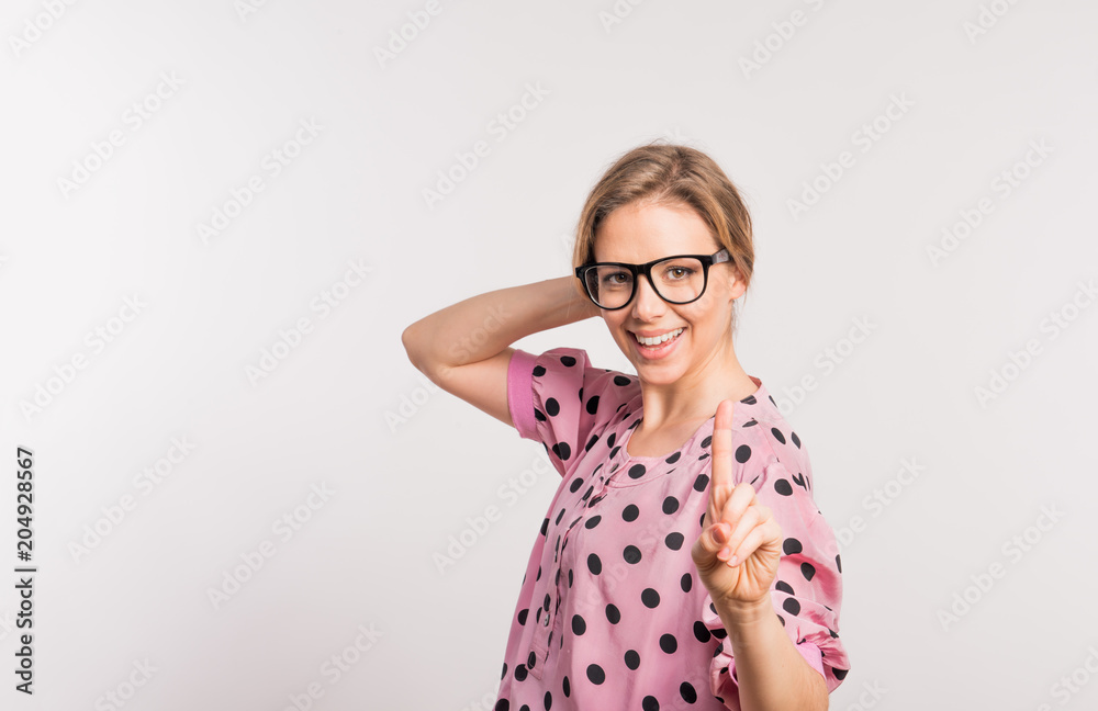 Portrait of a young beautiful woman in studio on a white background. Portrait of a young beautiful woman in studio on a white background.