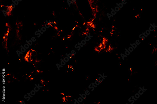 Smoldering coals on a black background