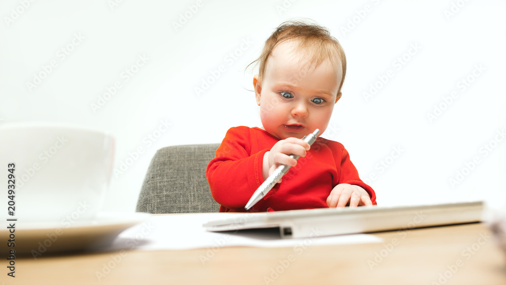 Happy child baby girl toddler sitting with keyboard of computer isolated on a white background Happy child baby girl toddler sitting with keyboard of computer isolated on a white background