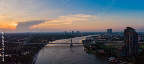 city and river in sunset