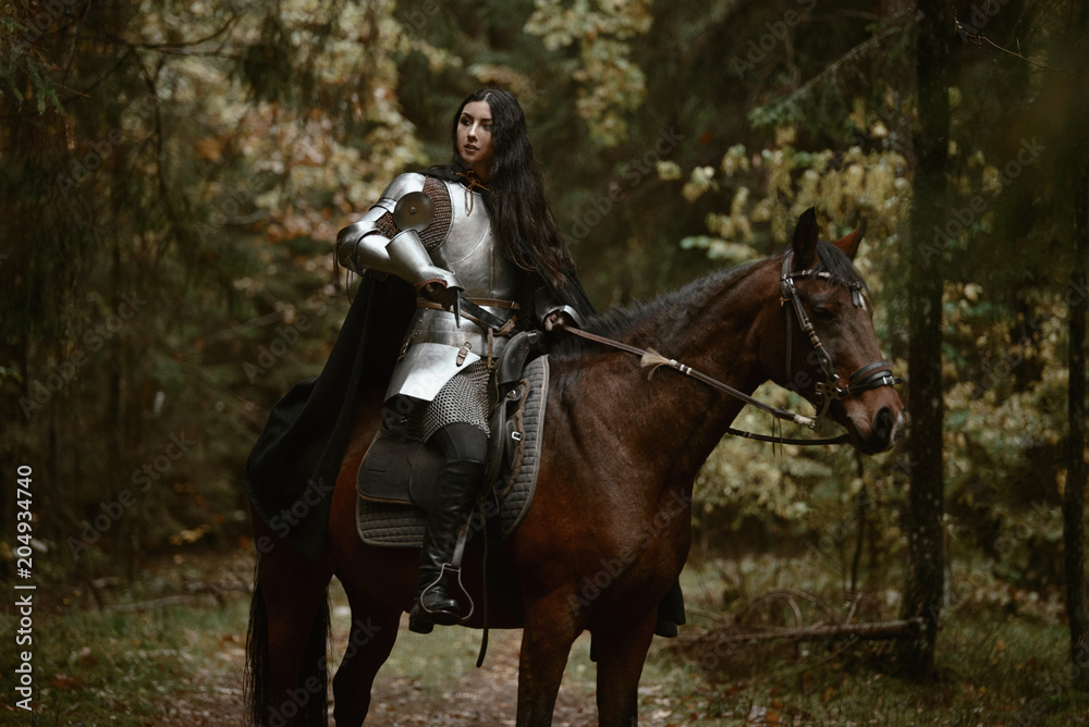 A beautiful warrior girl with a sword wearing chainmail and armor riding a horse in a mysterious forest. A beautiful warrior girl with a sword wearing chainmail and armor riding a horse in a mysterious forest.