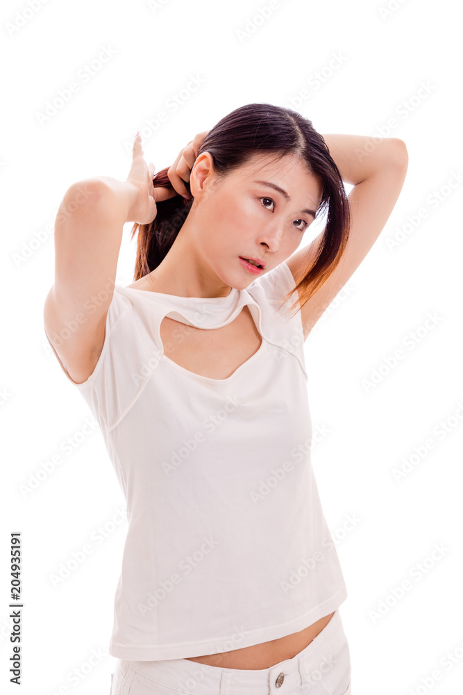 Taiwanese woman tying hair on white background Taiwanese woman tying hair on white background