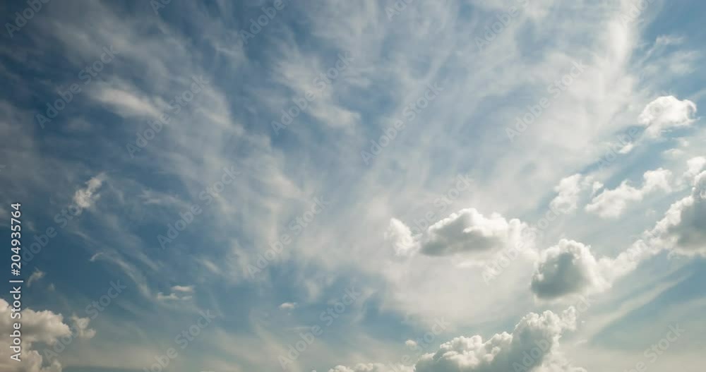 Time lapse clip of white fluffy curly rolling clouds Time lapse clip of white fluffy curly rolling clouds