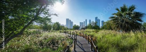Landscaped Green Island - a Nature Reserve with a Panorama of the City. Island - Butterfly Park, Sharjah, Emirates, Feb.2018