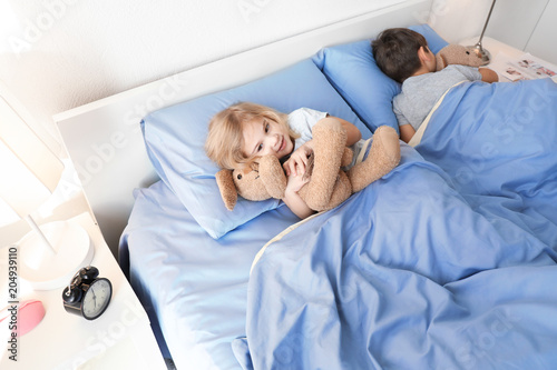 Cute children lying in bed....