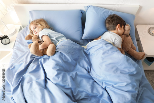 Cute children lying in bed....