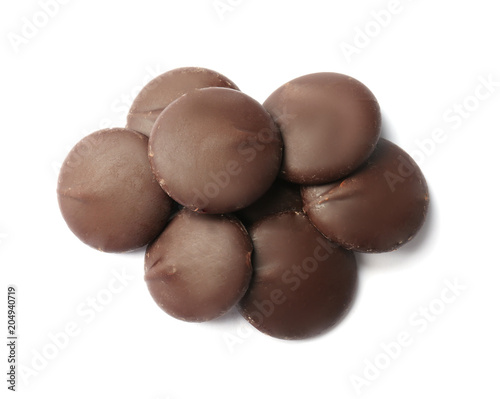 Delicious black chocolate chips on white background
