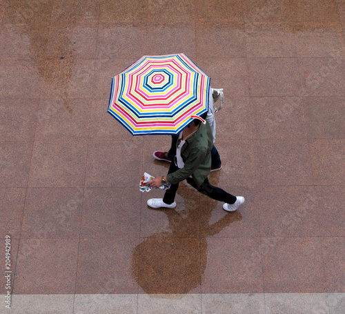 umbrellas city walk rainy summer day top view