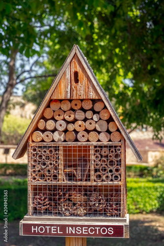 Insect hotel with compartments and natural components © Roberto Sorin