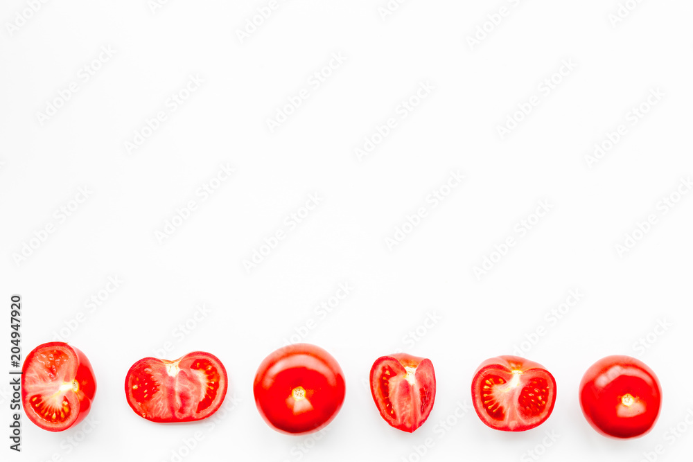 Layout of fresh red tomatoes on white background top view copy space Layout of fresh red tomatoes on white background top view copy space