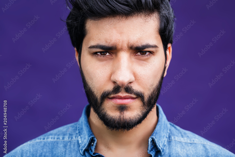 Portrait of eastern arabian man on purple background Portrait of eastern arabian man on purple background