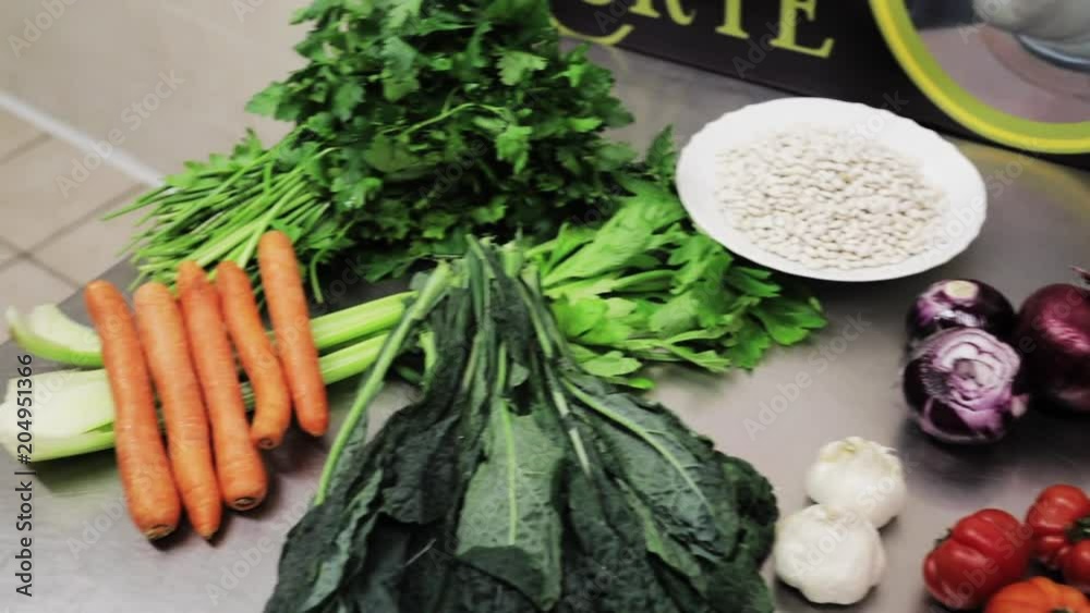 Pan left, fresh vegetables in restaurant kitchen Pan left, fresh vegetables in restaurant kitchen