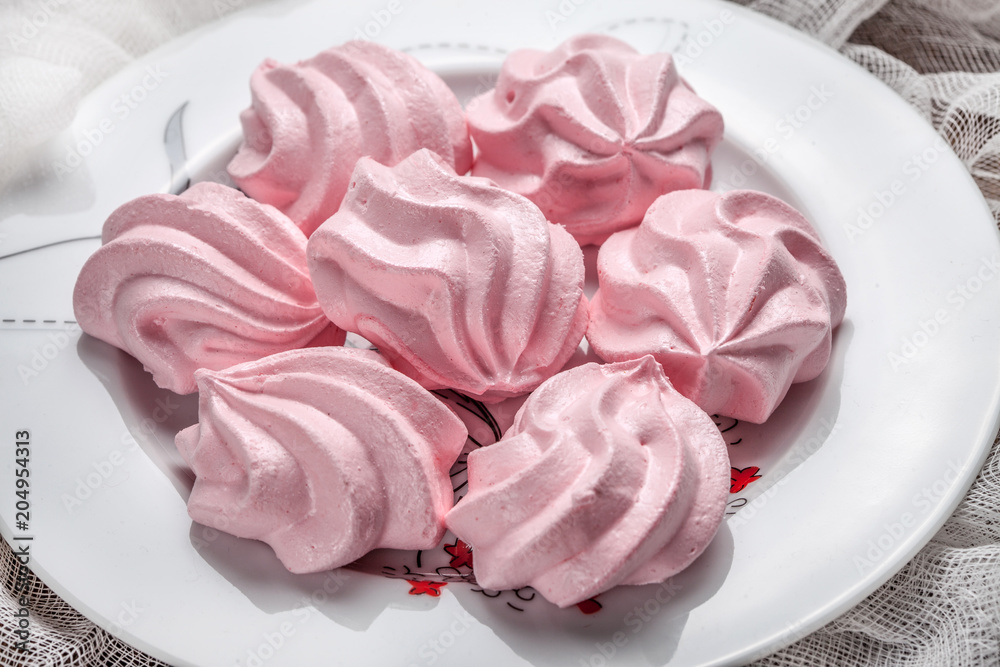 Pink meringue cookies.