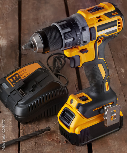 cordless drill, screwdriver, battery charger and drill