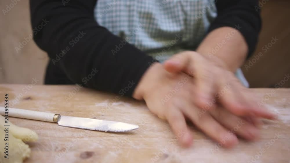 Close up, chef rolls pasta dough Close up, chef rolls pasta dough