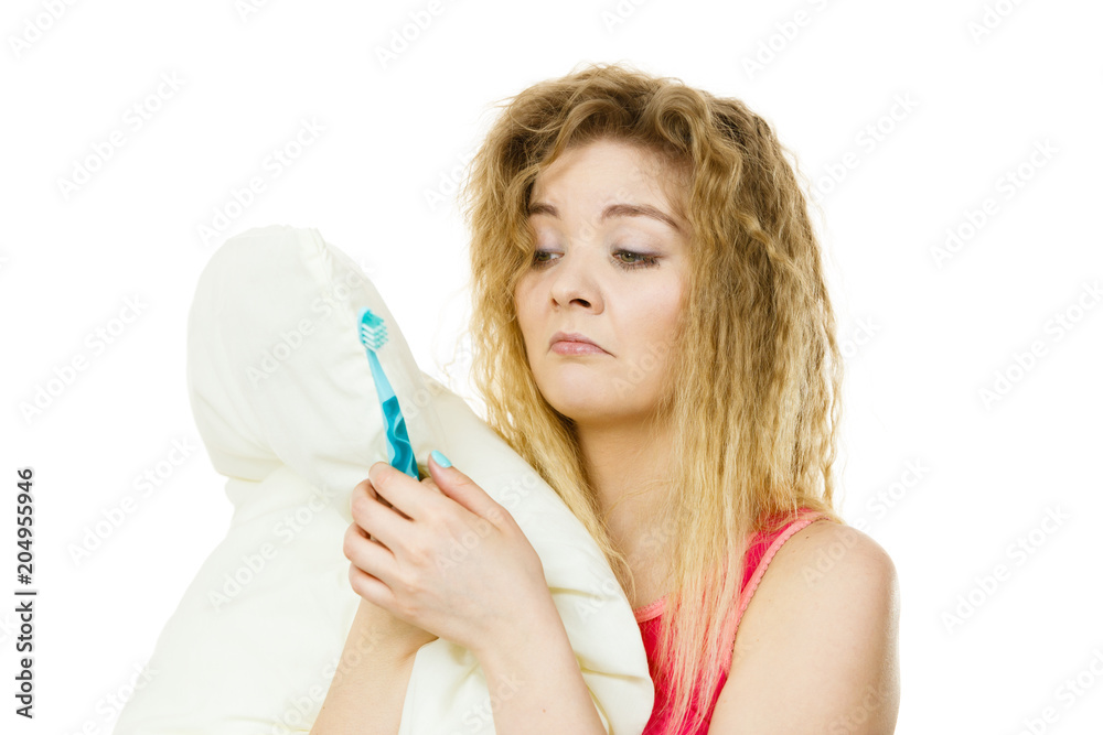 Sleepy woman hugging white pillow Sleepy woman hugging white pillow