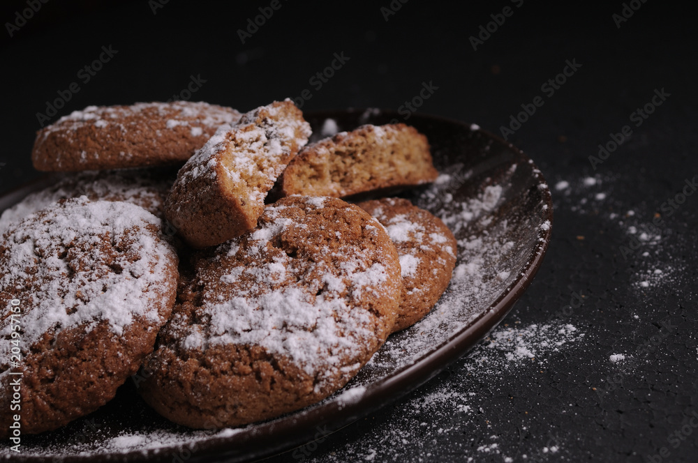 oatmeal cookies on a black table in castor sugar