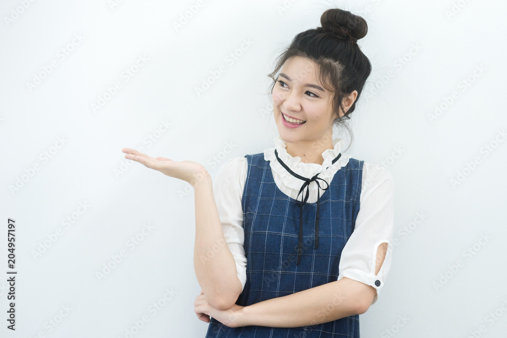Beautiful Woman presenting something on background Beautiful Woman presenting something on background