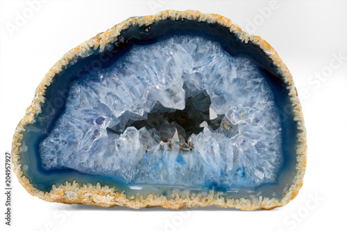 Geode with crystals of light-blue color. Cross section of natural stone. photo