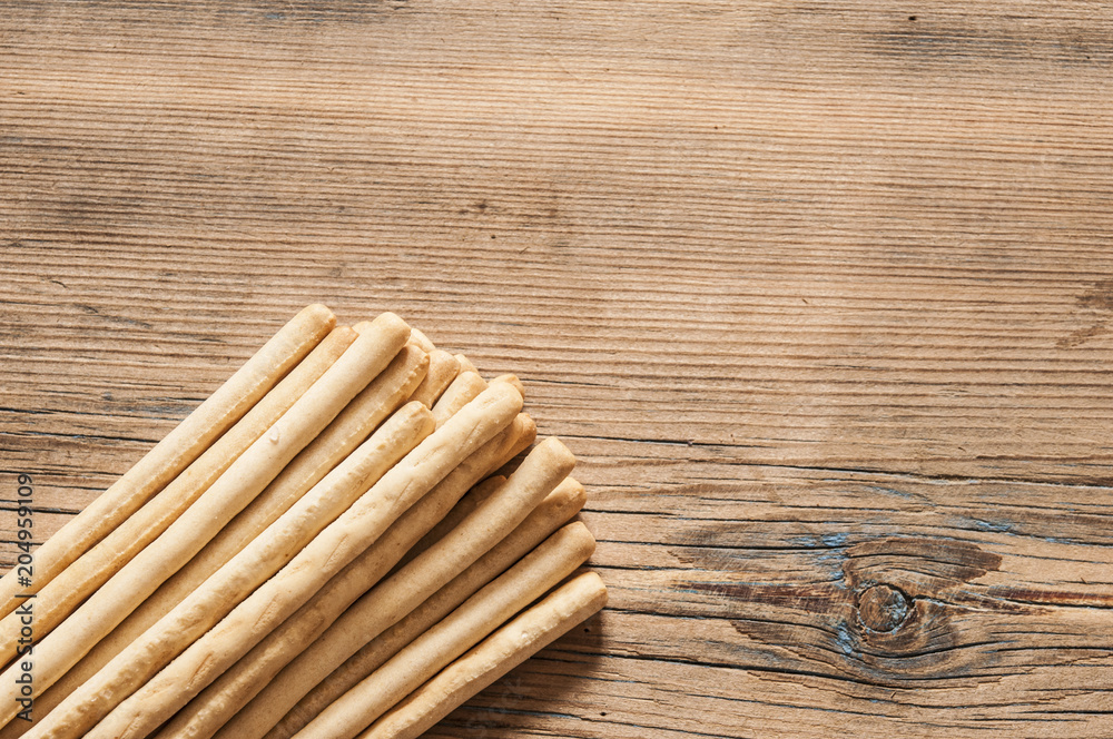 Fototapeta premium biscuit sticks on wood background