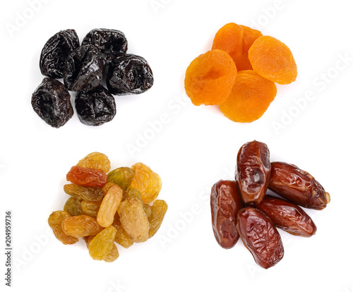 Set of dried fruits isolated on white background. Top view. Flat lay