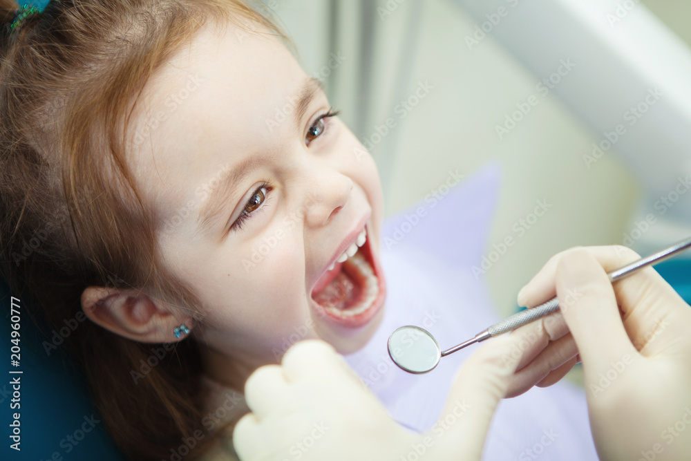 Child with wide open mouth at dentist office Child with wide open mouth at dentist office