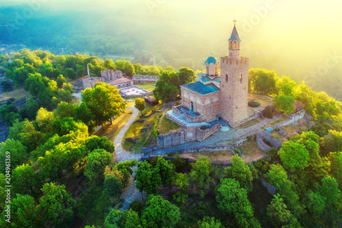 Aerial sunrise view of Tsarevets Fortress in Veliko Tarnovo in a beautiful summer day, Bulgaria 2018