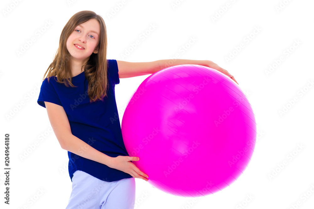 little girl is engaged in fitness with a ball. little girl is engaged in fitness with a ball.