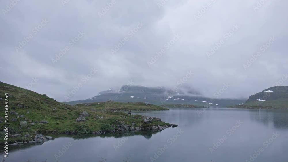 Beautiful Foggy Norway Landscape with Mountains Lake. 4K Ultra HD