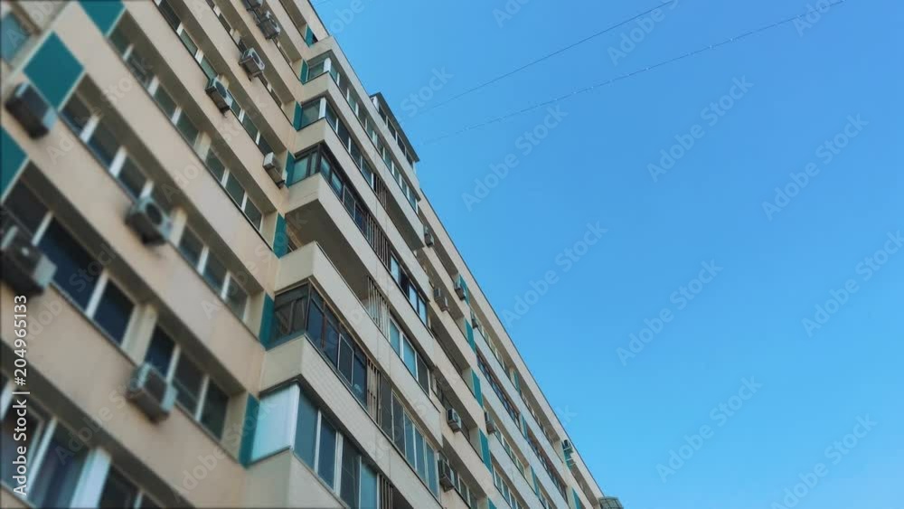 multi-storey house with air conditioning against the blue sky. concept city life lifestyle multi-storey house with air conditioning against the blue sky. concept city life lifestyle