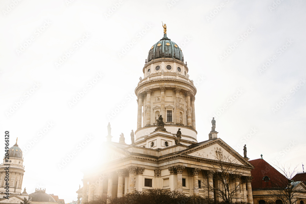 French Cathedral or Franzoesischer Dom in Berlin, Germany. Evangelic and Lutheran church of Germany and architecture monument or tourist sight.
