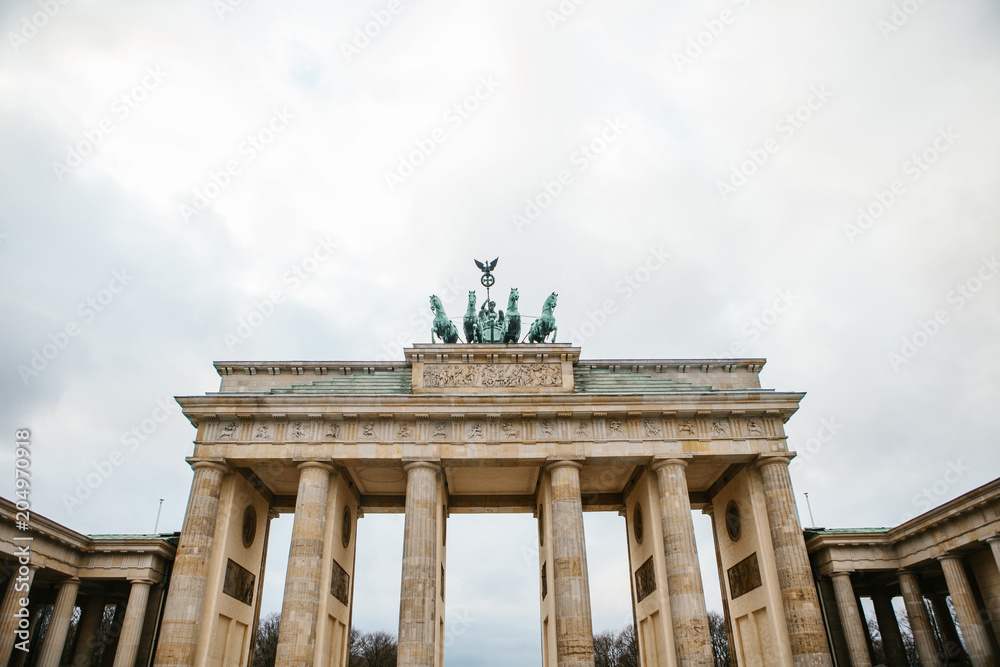 Brandenburg gate in Berlin, Germany or Federal Republic of Germany. Architectural monument in historic center of Berlin. Symbol and monument of architecture.