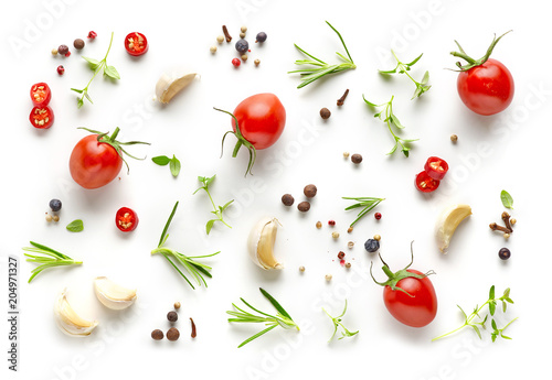 Fototapeta Naklejka Na Ścianę i Meble -  Tomatoes and various herbs and spices