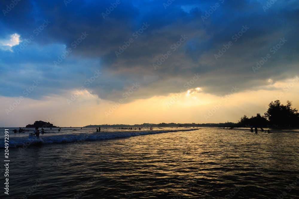 sunset over the ocean on a cloudy day sunset over the ocean on a cloudy day