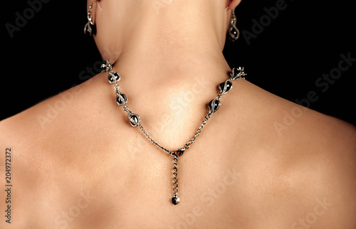 black pearls jewelry necklace on woman's back