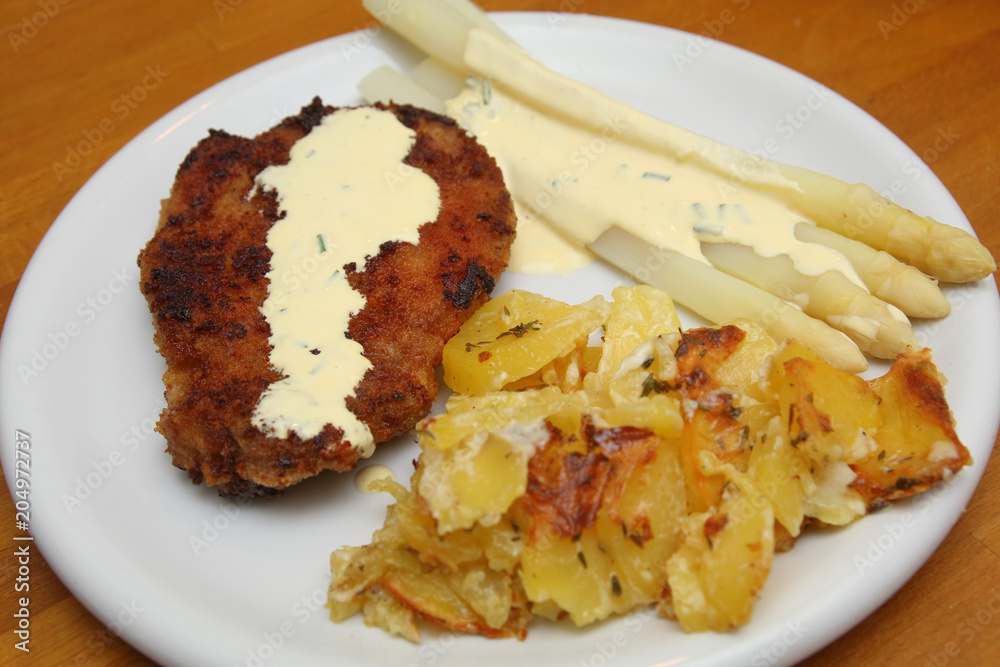 Schnitzel with asparagus and potato gratin