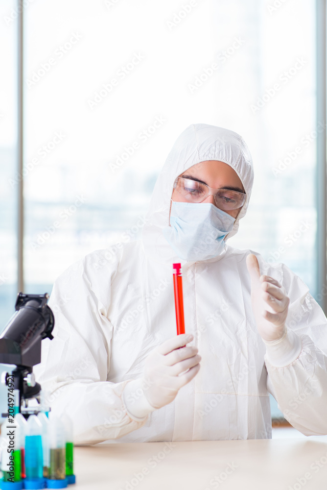 Male chemist working in lab Male chemist working in lab
