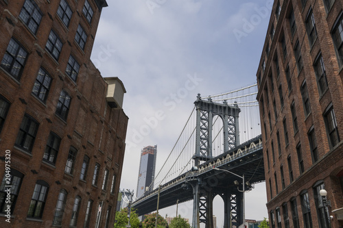 Manhattan Bridge in between buildings