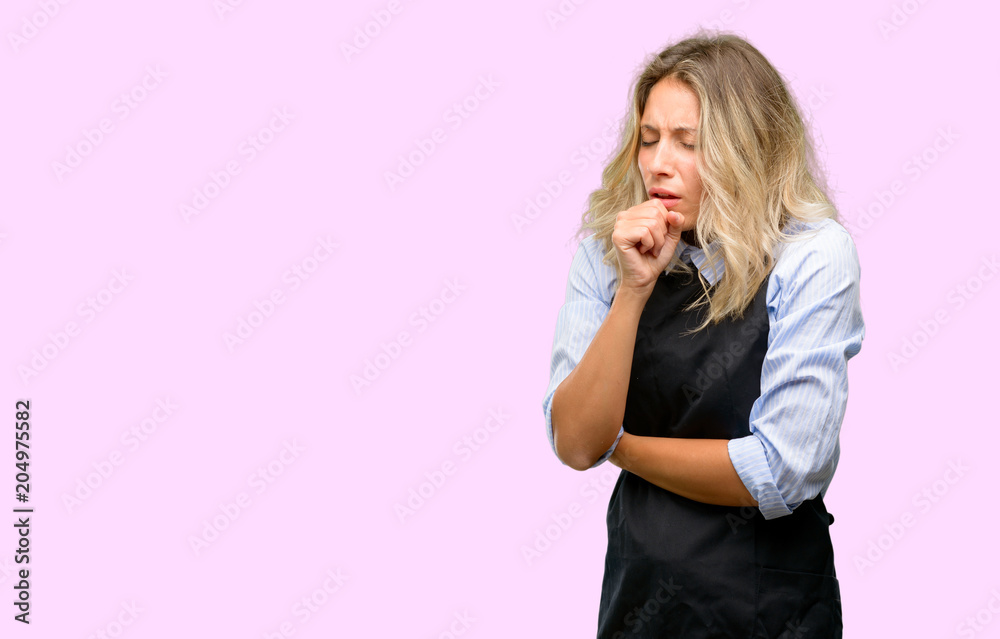 Young shop owner wearing black apron sick and coughing, suffering asthma or bronchitis, medicine concept Young shop owner wearing black apron sick and coughing, suffering asthma or bronchitis, medicine concept