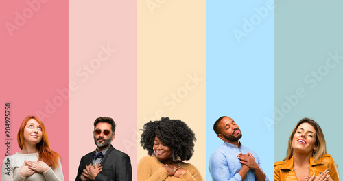 Cool group of people, woman and man with hands in heart, expressing love and health concept