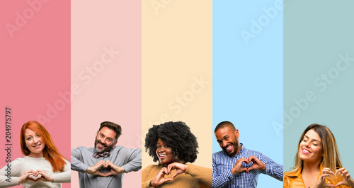 Cool group of people, woman and man happy showing love with hands in heart shape expressing healthy and marriage symbol