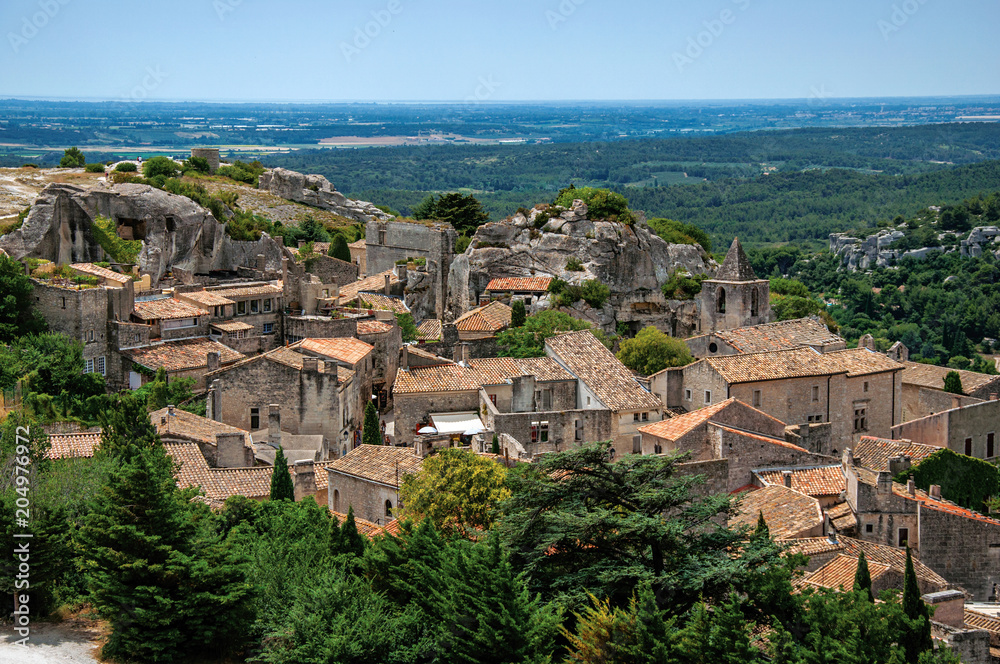 View of the roofs and houses of the village of Baux-de-Provence, with the hills of Provence just below. Bouches-du-Rhone department, Provence-Alpes-Côte d'Azur region, southeastern France
