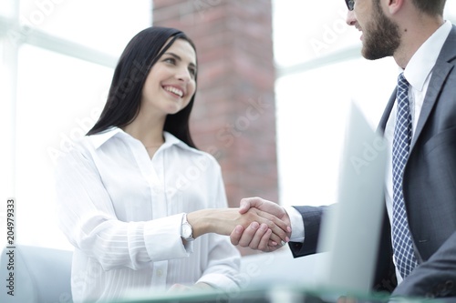 close-up of handshake businessman and business woman.