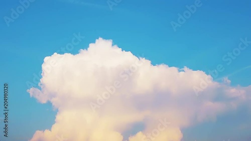 Timelapse of white moving fluffy clouds on a cyan background. Concept of  time passing and evolving situation. Concept of evolution and creation ideal for scientific videos.