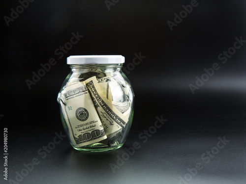 Canvas Print Money saving concept, glass jar full of dollars
