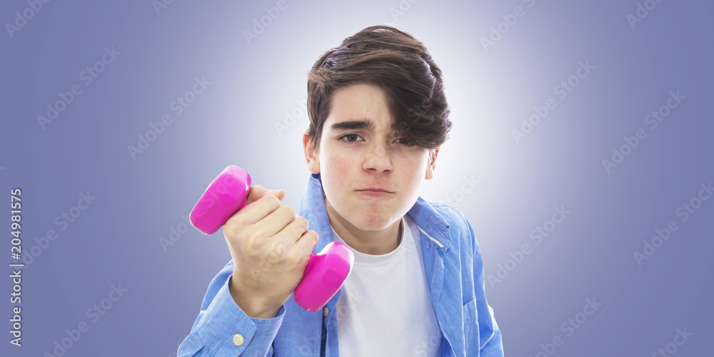 portrait of teenager lifting weight with effort portrait of teenager lifting weight with effort