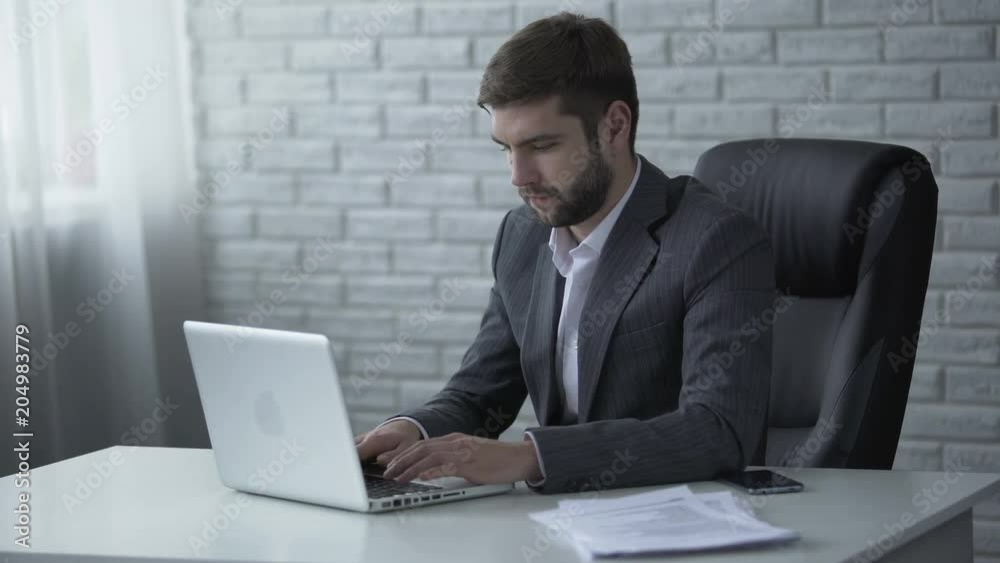Successful businessman typing on laptop insider info, solving business issues Successful businessman typing on laptop insider info, solving business issues