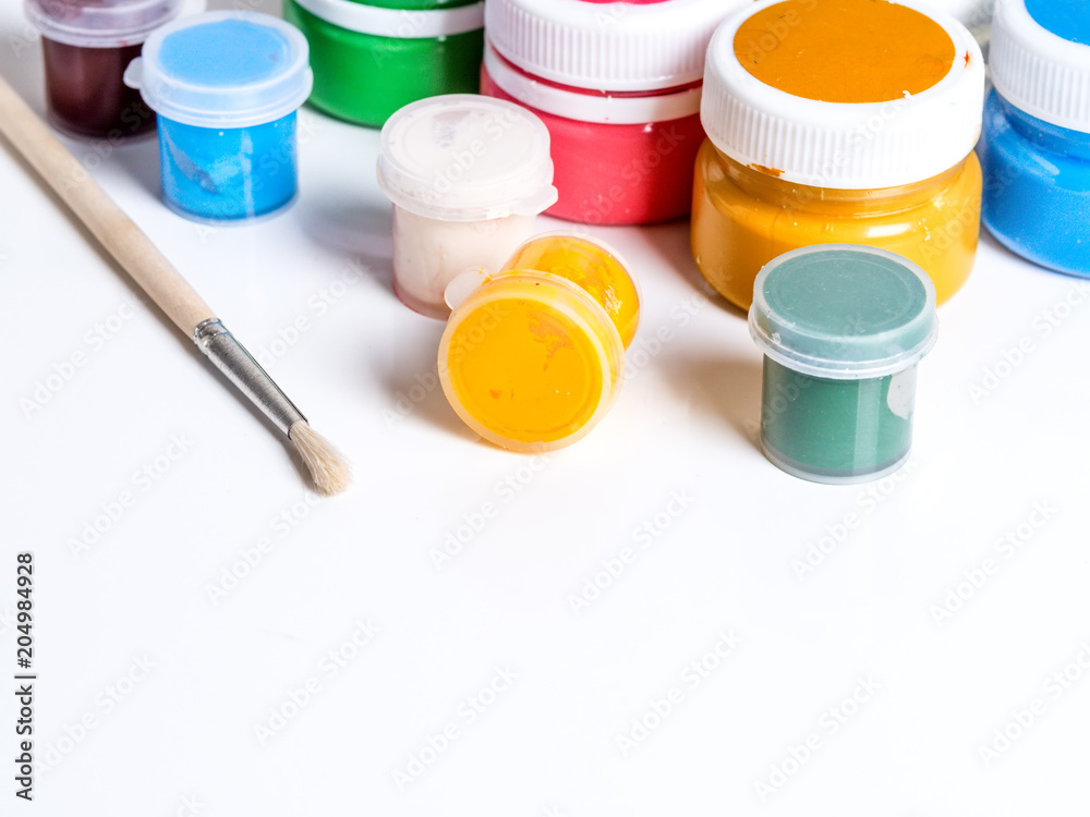Colorful vibrant cans of gouache. on a white background Colorful vibrant cans of gouache. on a white background